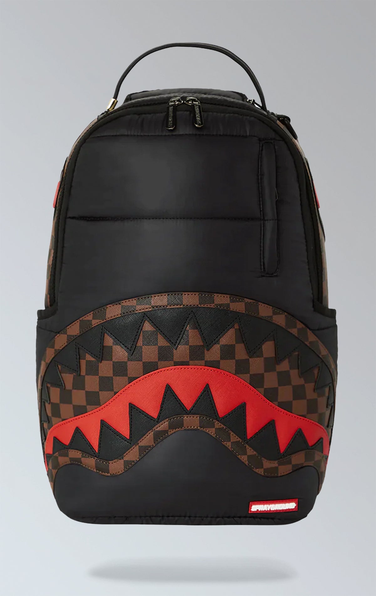 Black Sprayground backpack with a horizontal quilted puffer jacket-inspired design. Features multiple compartments including a separate velour laptop compartment, side pockets, and a hidden zippered pocket.  Equipped with ergonomic mesh back padding, adjustable straps, and a sliding back sleeve for attaching to carry-on luggage. Made from durable 100% polyester techy fabric with horizontal quilting.